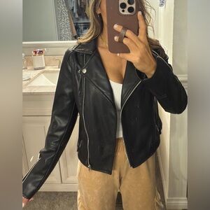 Small Black faux leather moto jacket with silver zipper and button detail